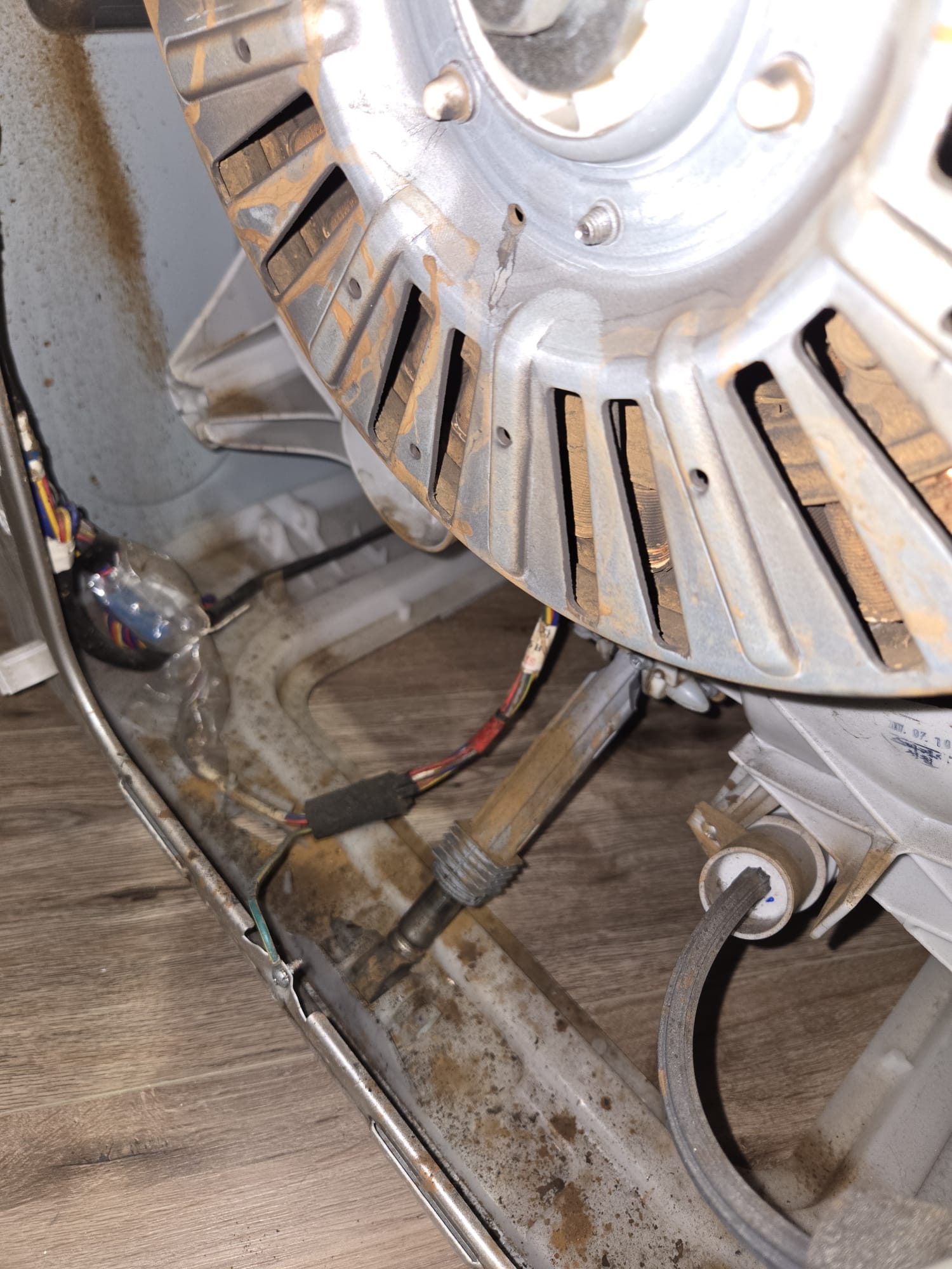 Worn dryer blower wheel removed during an airflow repair